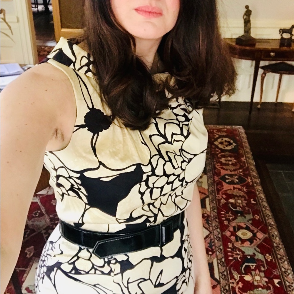 Below knew midi sleeveless dress in cream and black floral design with belt